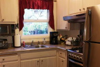 Stainless steel appliances add to the ambience of the Carriage House kitchen